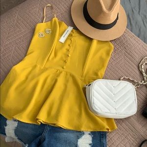 Mustard colored strapless blouse